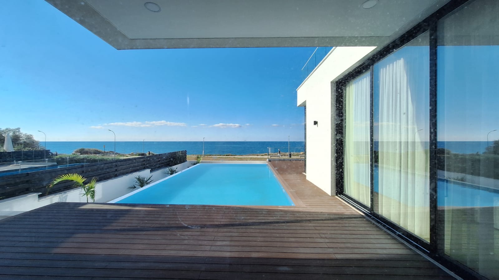 Poolside terrace with sea views